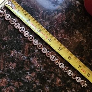Silver and diamond chip peace sign bracelet